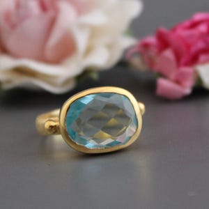 Handmade Blue Topaz Ring: Textured Band, Open Bezel Setting
