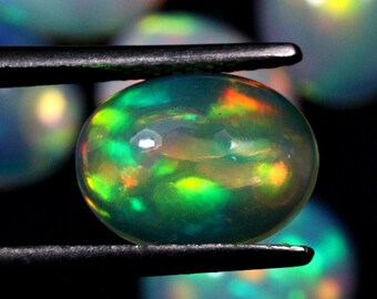 Natuurlijke Ethiopische opaalcabochon: meerkleurige ovale edelsteen, 7 x 9 mm