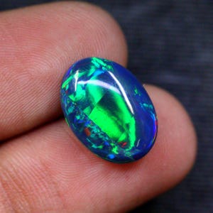 Opale etiope naturale ovale di qualità AAA, opale multi-fuoco per la creazione di gioielli (16x12x5mm)