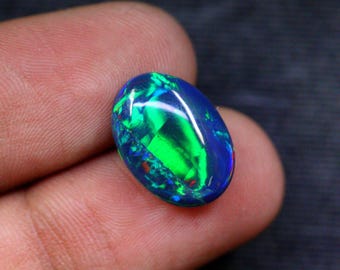 Naturalny opal etiopski o owalnym kamieniu szlachetnym, jakości AAA, wielowarstwowy opal ognisty do wyrobu biżuterii (16x12x5 mm)