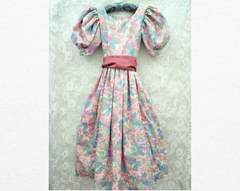 Vintage 1980s floral pink girls dress with oversized puffed sleeves and sash