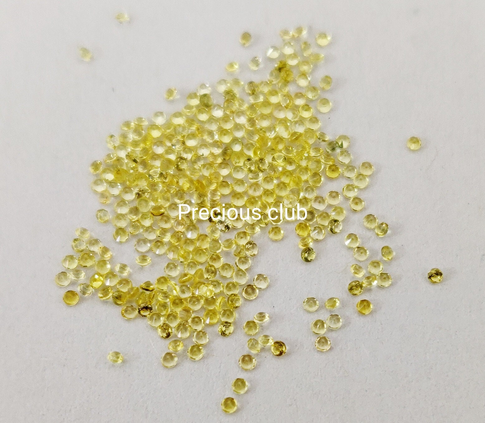 天然のみ加熱イエローサファイア 1.25 mm ラウンドブリリアント