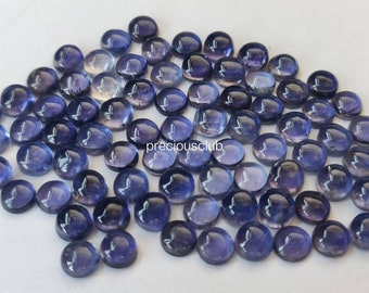 May include: A collection of 50 round, faceted, purple amethyst gemstones. The gemstones are approximately 6mm in diameter and have a smooth, polished finish.