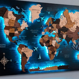 May include: A rectangular wooden world map wall art piece featuring multi-tonal brown continents with engraved country names and borders. The map is backlit with bright blue LED lighting and includes decorative wooden airplane and sailboat icons.