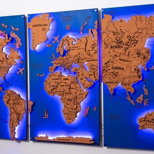 A triptych of illuminated world maps, each depicting a different continent, with the maps illuminated in blue and orange colors.