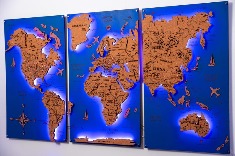 A triptych of illuminated world maps, each depicting a different continent, with the maps illuminated in blue and orange colors.