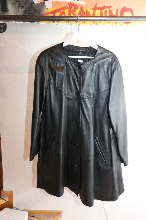 black vintage leather coat with shoulder pads