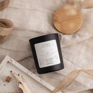 May include: Black candle jar with a white label that reads "Chance made us colleagues but the fun & laughter we share made us friends". The label features a butterfly graphic.