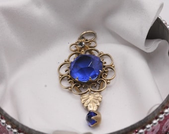 Silver 875 gold plated filigree pendant with blue crystal stone.