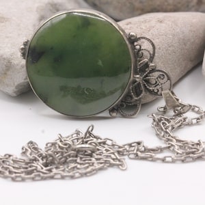 Vintage silver-plated pendant with jade stone.