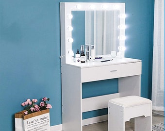 vanity with desk and lights