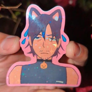 May include: A pink sticker featuring a cartoon character with cat ears, a black collar, and a blue shirt. The character has a tired expression, with blue sweat droplets and glitter accents.
