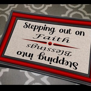 May include: A black and red doormat with the text "Stepping into Blessings Stepping out on Faith" in white lettering.
