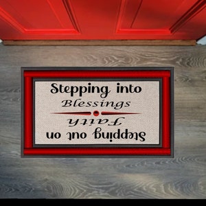 May include: A doormat with a red border and black text that reads "Stepping into Blessings Stepping out on Faith".