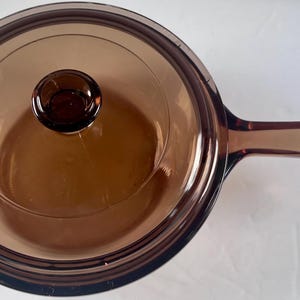 May include: A rustic wooden sign with the text "Welcome to our home" in white lettering. The sign features a distressed finish and a simple, inviting design, perfect for entryway decor.