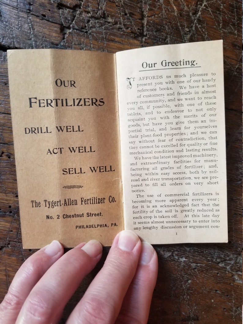 May include: A vintage pamphlet advertising Tygert-Allen Fertilizer Co. located at 2 Chestnut Street in Philadelphia, PA. The pamphlet promotes the benefits of using their fertilizers, emphasizing their quality, effectiveness, and accessibility. The text highlights the importance of fertilizers for maintaining soil fertility and improving crop yields.