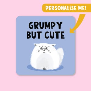 May include: A square, light blue graphic features a cartoon white cat with an angry expression. The text "GRUMPY BUT CUTE" is above the cat. A yellow banner at the top right says "PERSONALIZE ME!"
