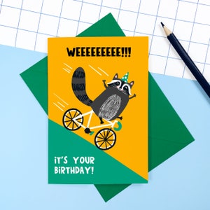 Carte d'anniversaire raton laveur - joyeux anniversaire - vélo - mignon - animal - cyclisme - pipi - fêter - chapeau de fête