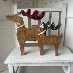 Rustic Christmas reindeer shelf decor for Holiday mantel  accented with buffalo plaid.