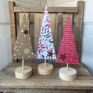 Country Christmas trees set for Holiday mantle decor done in winter farmhouse patterns. Great stocking stuffer gifts.