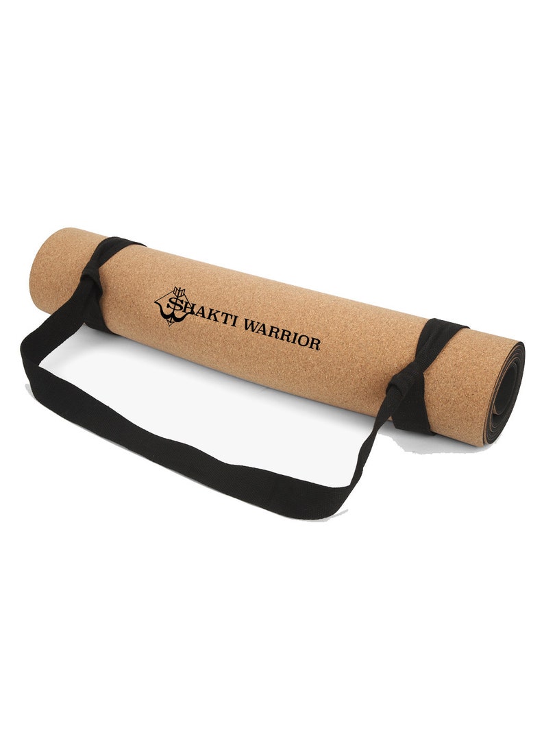 May include: A rolled up cork yoga mat with a black carrying strap. The mat has the text "SHAKTI WARRIOR" printed on it.