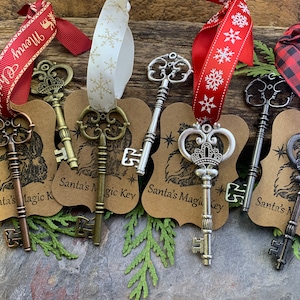 May include: Six antique-style skeleton keys with ornate designs, each attached to a brown card with the text "Santa's Magic Key". The keys are tied with red and white ribbon.
