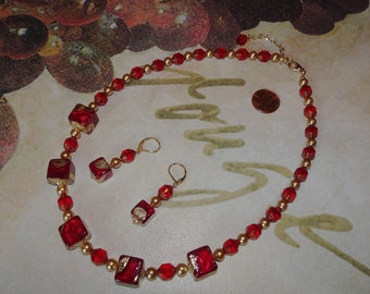 Handmade necklace & earring set with deep red Murano cubes highlighted by gold foil