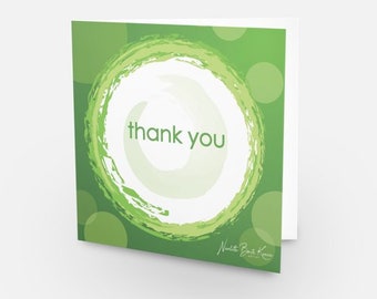 May include: Green thank you card with a white circle and the words "thank you" in the center. The circle is surrounded by a green and white brushstroke design. The card has a green and white polka dot background.