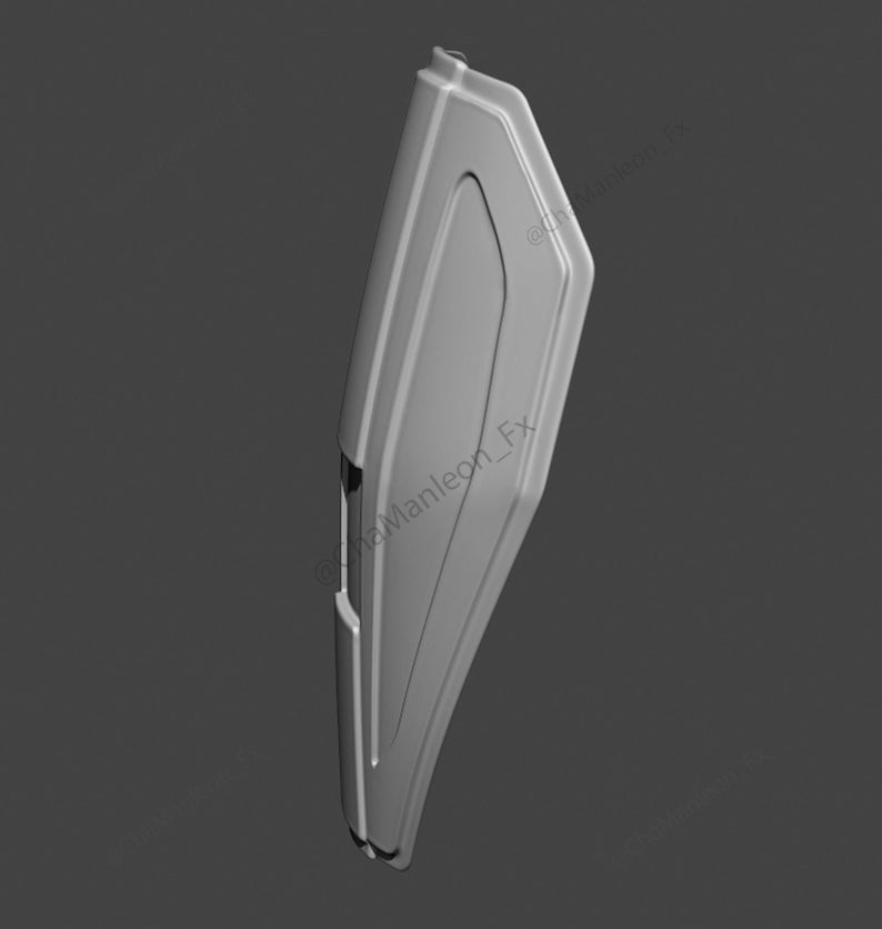 May include: A gray, 3D-printed model of a shield with a raised, rectangular design in the center. The shield is angled to the right, and the bottom edge is slightly rounded.