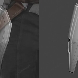 May include: A silver-colored, futuristic-looking weapon with a sharp point and a textured surface. The weapon is attached to a belt.
