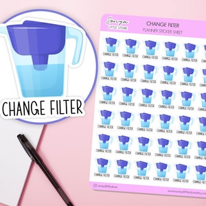 May include: A sheet of planner stickers featuring a blue water filter jug with the text "Change Filter" repeated on each sticker.