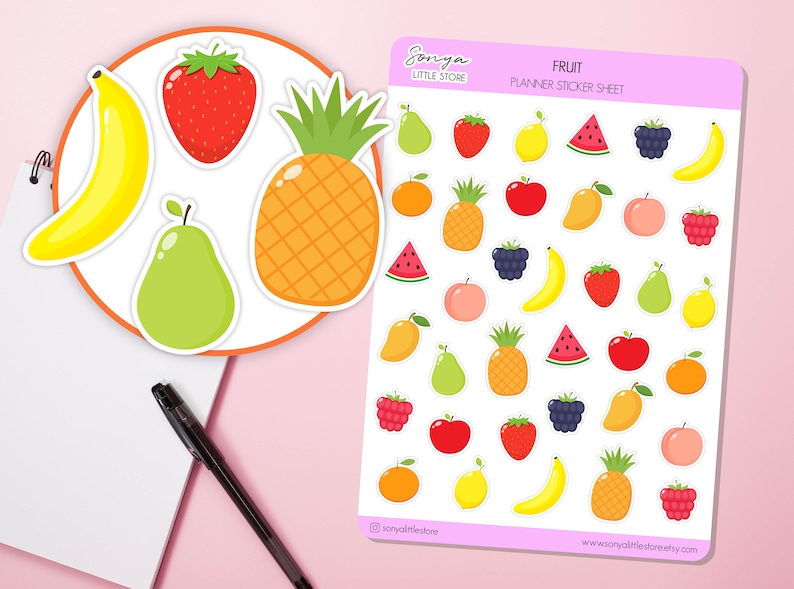 May include: A sheet of fruit planner stickers with a variety of fruits including bananas, strawberries, pineapples, pears, lemons, watermelons, blackberries, peaches, raspberries, apples, oranges, and mangos. The sticker sheet is white with a pink border and the text "FRUIT PLANNER STICKER SHEET" in black.