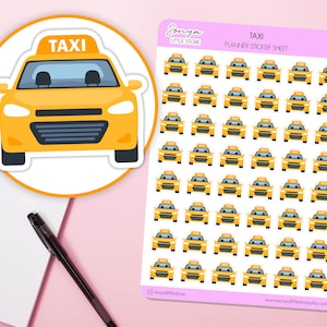 May include: A sheet of yellow taxi planner stickers with a pink border. The stickers feature a yellow taxi cab with the word "TAXI" on top. A large taxi sticker is on the left. A pen and notepad are in the background.