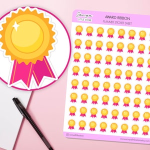 May include: A sheet of planner stickers featuring 49 gold award ribbon stickers with pink ribbons. The stickers are arranged in a grid pattern on a white background. The text "AWARD RIBBON PLANNER STICKER SHEET" is printed at the top of the sheet.