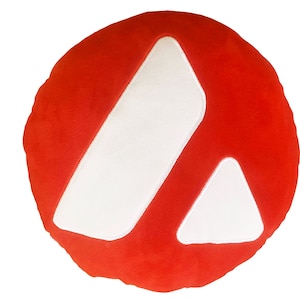 May include: A red round pillow with a white letter A embroidered on it.