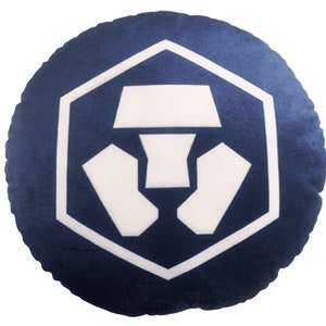 May include: A round blue cushion with a white logo of a hexagon with a stylised symbol inside.