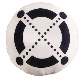 May include: A white round pillow with a black geometric design. The design features a circle with a dotted line across the center and two curved lines on either side.