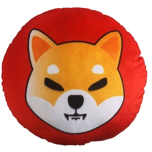 May include: Round red pillow with a white and orange Shiba Inu dog face printed on the front.