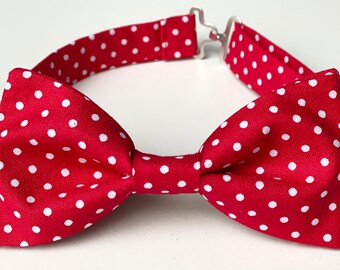 May include: Red bow tie with white polka dots.