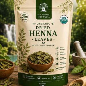 May include: A beige pouch of Real Organic Tree House organic dried henna leaves with a net weight of 200g. The packaging features green text and graphics, including a bowl of dried leaves, a tree logo, and a list of benefits like hair health.