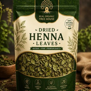 May include: A stand-up pouch of Real Organic Tree House dried henna leaves. The packaging is dark green and cream with a clear window showing the dried green leaves inside. Text includes 100% Natural & Chemical Free, Natural Pure Premium Quality.