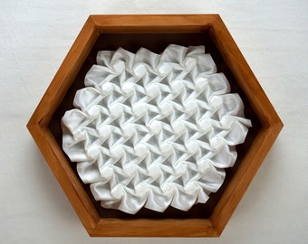 Hexagons and Bars I fabric tessellation wall art, made from a single sheet, framed in a stained pine hexagon. Easy to hang + totally unique