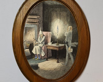 May include: An oval framed illustration of a man in a white nightgown sitting in a chair with a ghost standing behind him. The ghost is wearing a long white robe and has a long white beard. The scene is set in a dimly lit room with a fireplace in the background.