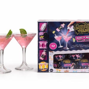 May include: Two pink cocktails in martini glasses, garnished with lime wedges, sit next to a box set. The box features the text "Mini Verse" and "Make it Mini Happy Hour". The set includes miniature cocktail-making supplies.