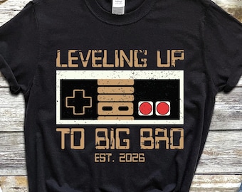 Camiseta, moletom com capuz e blusa de moletom "Subindo de nível para irmão mais velho em 2026", para futuros irmãos, gamers, anúncios de novos bebês, presentes para irmãos.