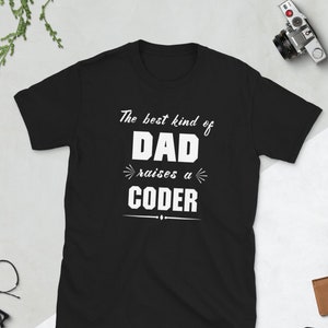 May include: Black t-shirt with white text that reads "The best kind of Dad raises a Coder".