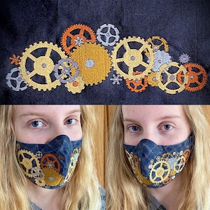 May include: A blue face mask with a design of gears and cogs. The mask is made of fabric and has a dark blue background with gold and white gears.