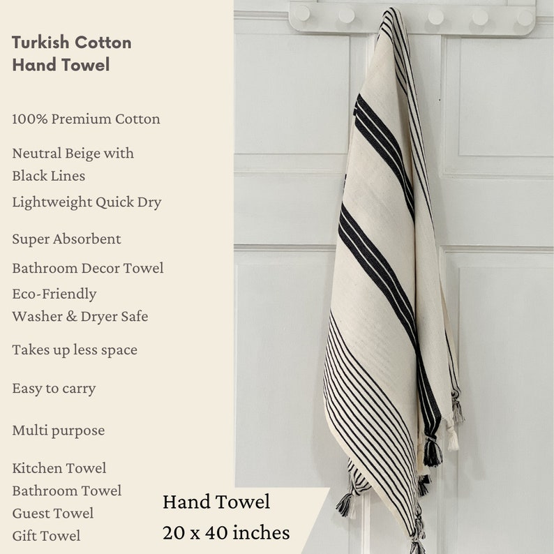 Puede incluir: Una toalla de mano blanca con rayas negras colgada de un gancho. La toalla est&aacute; hecha de 100% algod&oacute;n premium, es ligera, se seca r&aacute;pidamente y es s&uacute;per absorbente. Mide 50 x 100 cm y es adecuada para usar en el ba&ntilde;o, la cocina o como toalla de invitados.