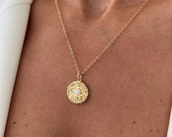 Goudgevulde boze oog-muntketting: opaal en zirkonia