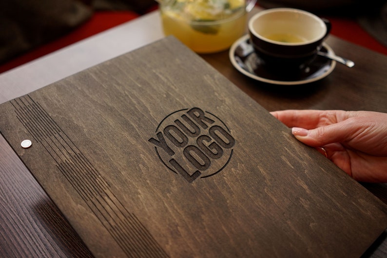 May include: A dark brown wooden menu cover with a circular logo that says "YOUR LOGO" in black text.